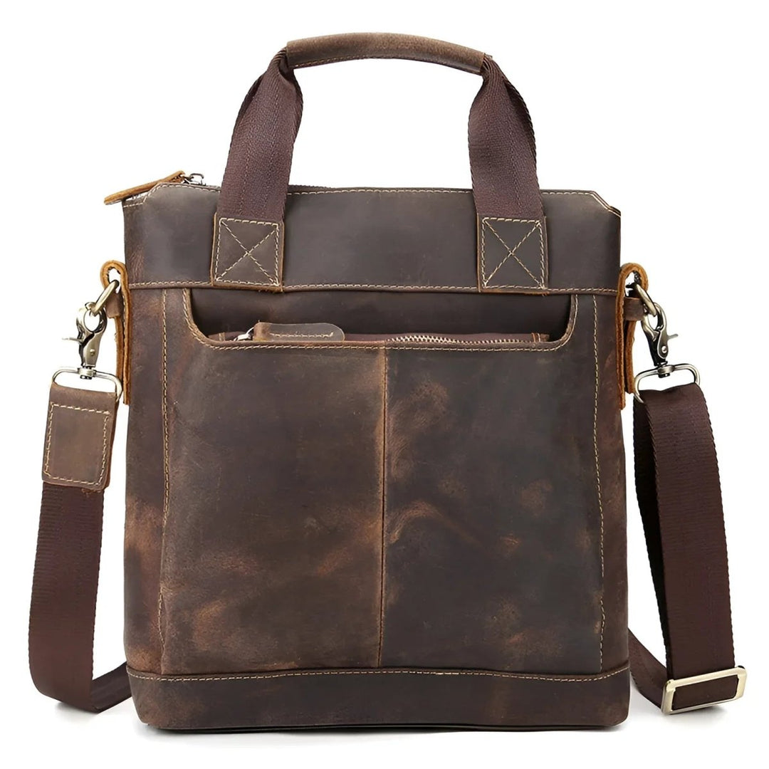Stylish full leather messenger bag/satchel with sturdy handles and adjustable strap for versatile carrying.