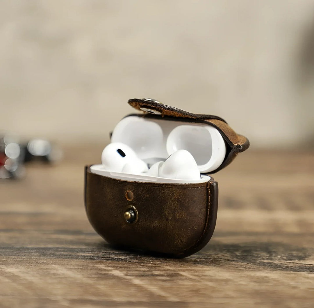 Stylish leather airpod case with AirPods inside, perfect for protection and elegance.