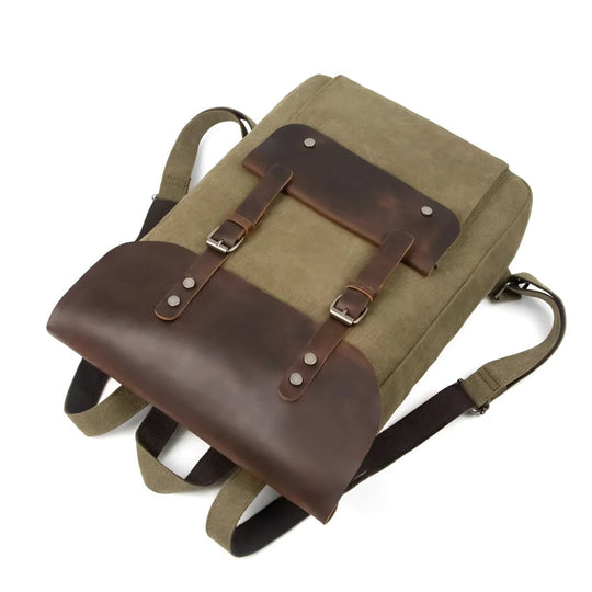 Stylish vintage leather/canvas backpack with durable straps and a classic design, perfect for everyday use.
