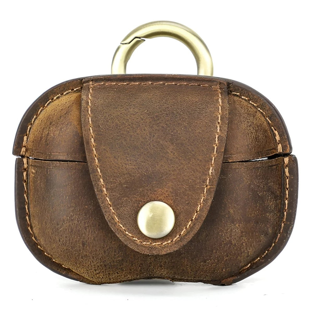 Stylish leather airpod case with gold hardware for secure and chic storage. Perfect for everyday use.
