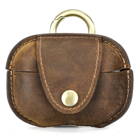 Stylish leather airpod case with gold hardware for secure and chic storage. Perfect for everyday use.