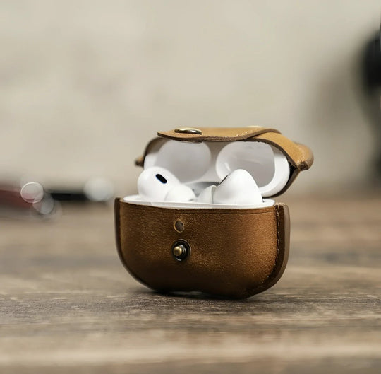 Stylish brown airpod case with a secure snap closure, perfect for keeping your AirPods safe and chic.
