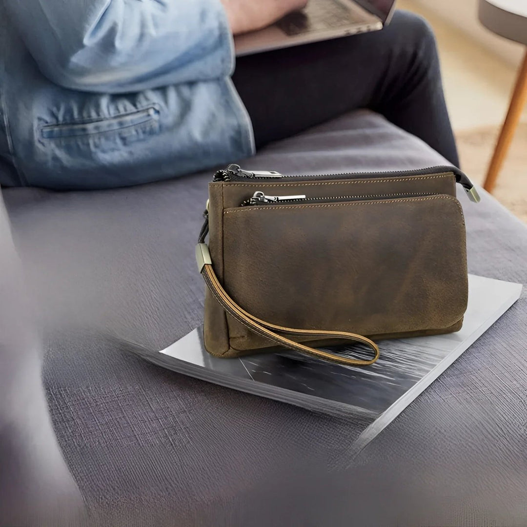 Stylish full grain leather tech travel bag on a table, perfect for modern travelers and tech lovers.