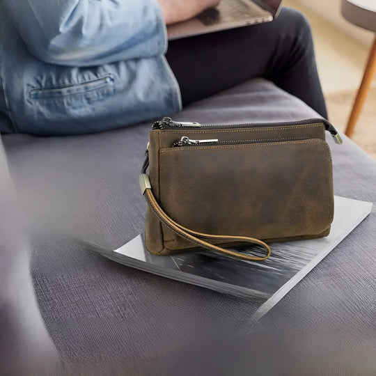Stylish full grain leather tech travel bag on a table, perfect for modern travelers and tech lovers.