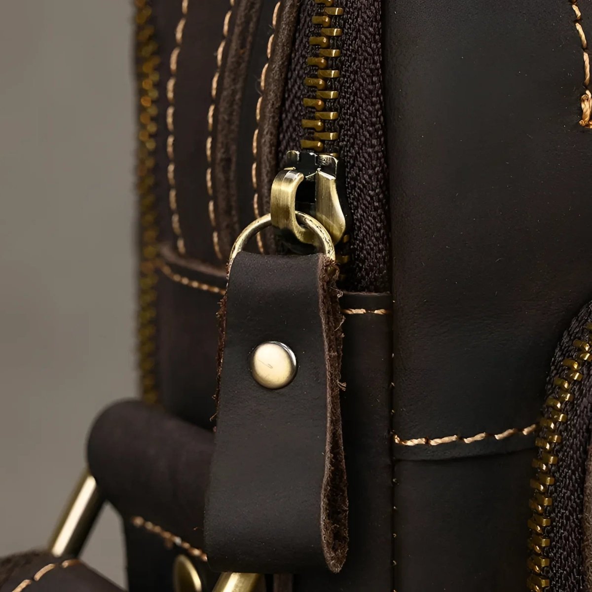 Stylish zipper detail on The tablet satchel, perfect for keeping your essentials secure and organized.