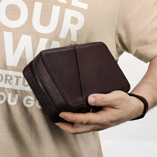 Sleek travel cable organizer held in hand, perfect for keeping your electronic accessories tidy on the go.