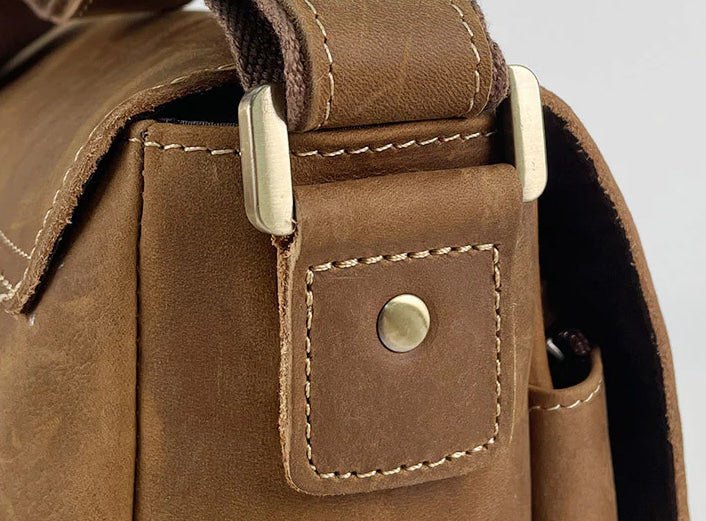 Rich brown leather detailing on The Classic Laptop Bag, showcasing quality craftsmanship and stylish design.