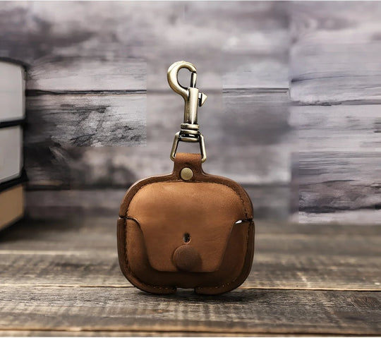 Stylish Airpods 3 leather case in brown, featuring a secure clip for easy attachment. Perfect accessory for your earbuds.