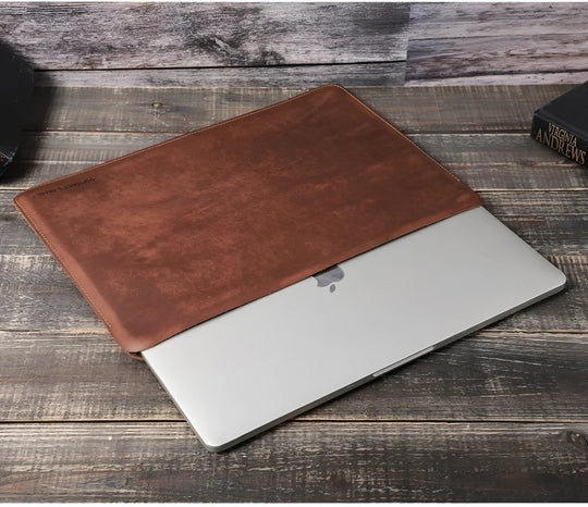 Genuine leather sleeve 13" stylishly protects your laptop with a rich, classic design perfect for any occasion.