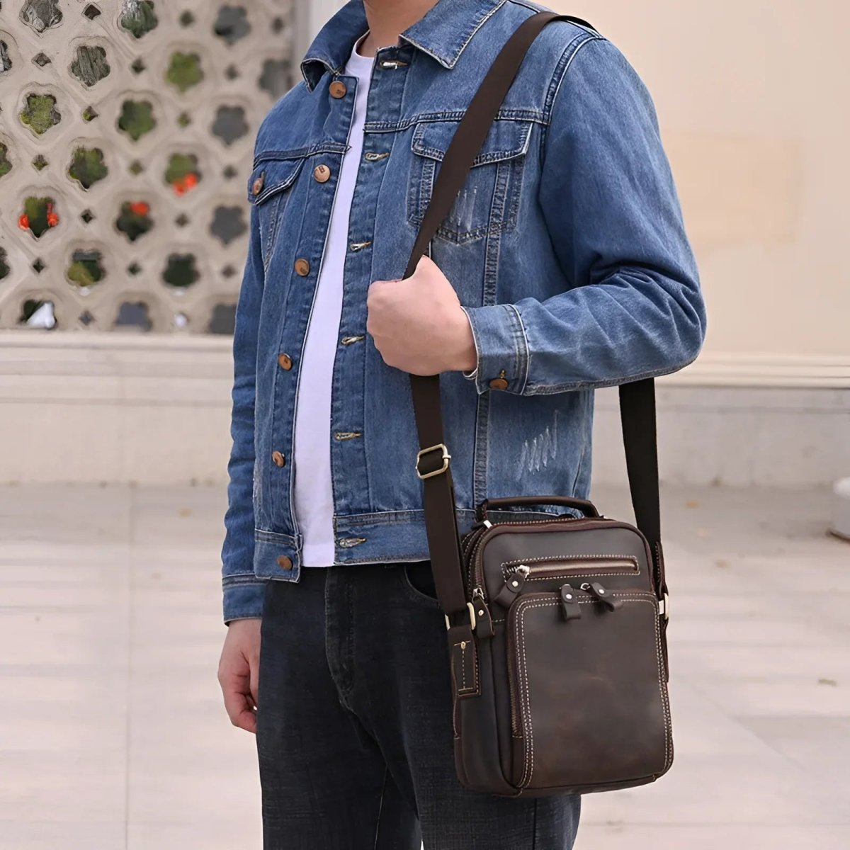 The tablet satchel is stylishly worn across the body, perfect for everyday use and modern aesthetics.