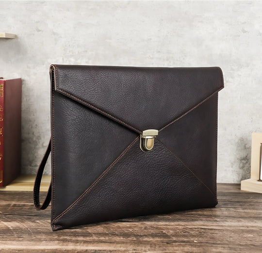 Stylish Leather Laptop Sleeve macbook 13/14 inch with elegant design and secure clasp, perfect for professionals.