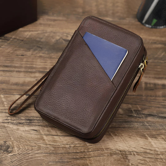 Brown leather travel cable organizer with a pocket, perfect for keeping your tech essentials tidy on the go.