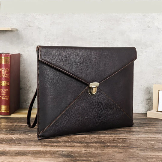 Stylish Leather Laptop Sleeve macbook 13/14 inch with elegant design and secure clasp, perfect for professionals.
